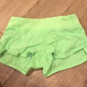 neon yellowish green ivivva running shorts
